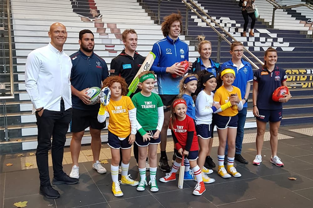  The Tiny Trainers and athletes Michael Klim (Retired swimming Olympic legend), Jermaine Ainsley (Rugby Union - Melbourne Rebels), Mackenzie Harvey (Cricket – Melbourne Renegades), Ben Brown (AFL – North Melbourne), Melissa Tapper (Table Tennis - Paralympics Australia), Jaryd Clifford (Athletics – Paralympics Australia) and Lily Mithen (AFL – Melbourne) Spread the Find Your 30 message at Melbourne's Southern Cross Station. Photo: Supplies
