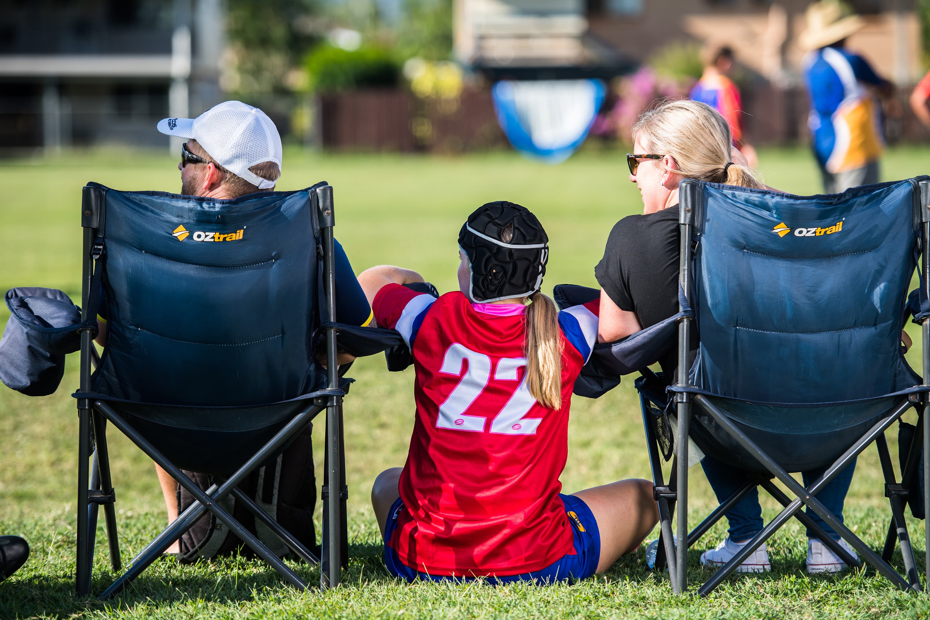 Parents sitting next to child