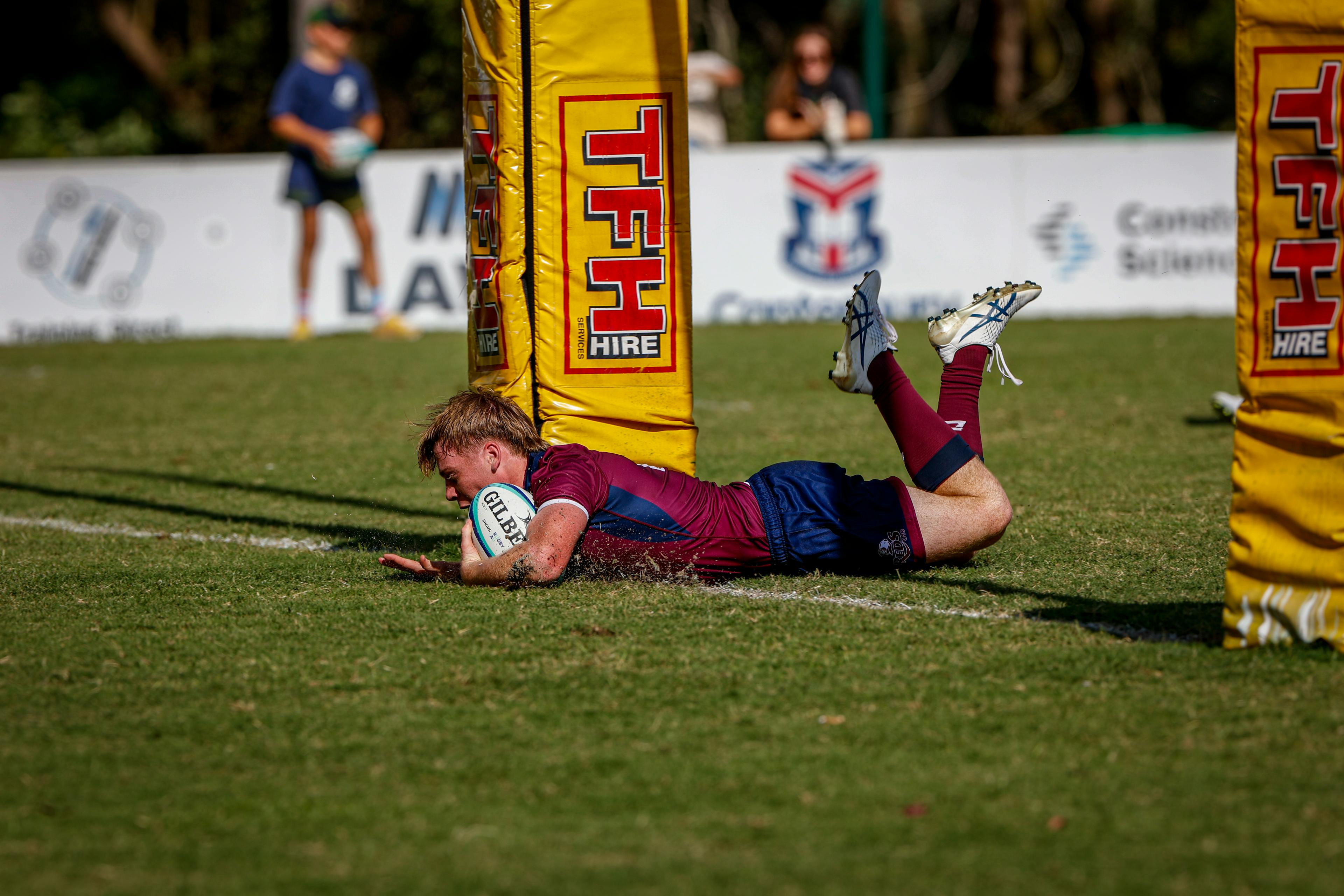 Eye-catching flyhalf Harry McLaughlin-Phillips dives over for his neat-stepping try. Photo: Kev Nagle