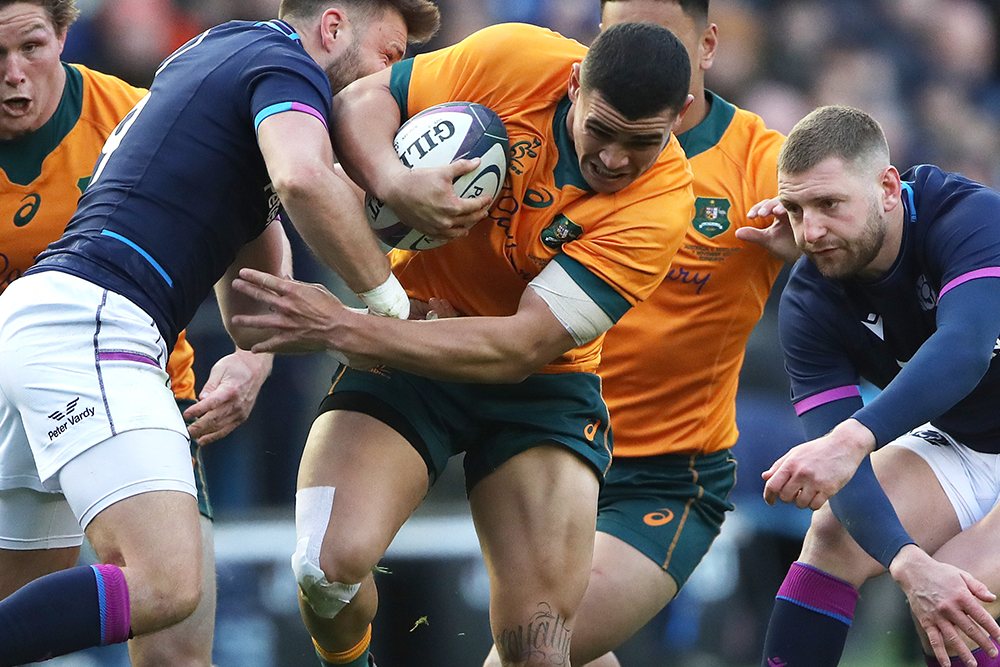 Perese looks to break a tackle on debut against Scotland. Photo: Getty Images